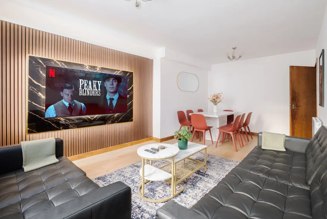 Oak panel TV wall with a 75 inch screen