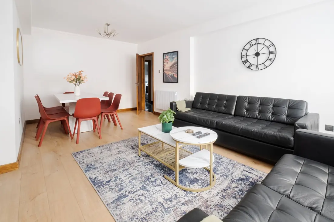 Living room with the dining table by the door