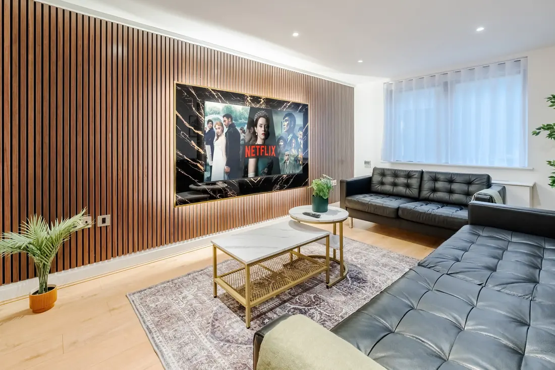 Sofas, marble coffee tables and the TV wall